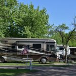 A flag and RV campsites at Tower Campground in Sioux Falls South Dakota